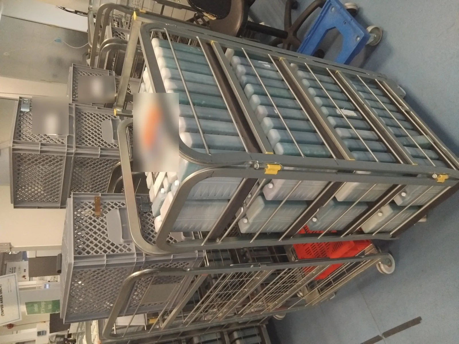Cage of cold-chain gel ice packs used by Red Eagle Logistics for temperature-controlled courier deliveries