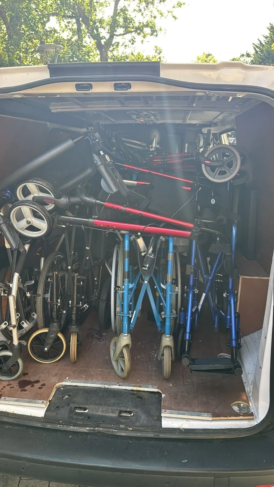 A Red Eagle Logistics van loaded with wheelchairs, rollators and walking frames for a London to Peterborough delivery
